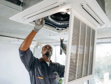 HVAC technician inspecting a home's ducts