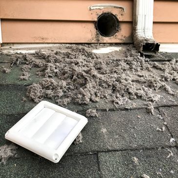 Dryer vent cleaning result showing removed lint buildup
