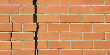 Cracked chimney masonry requiring professional repair