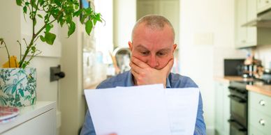 Homeowner looking at their energy bill.